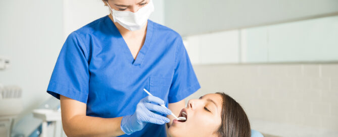 orthodontist examines patient after injury